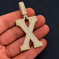 Iced Out “X” Letter Pendant Gold Finish with Baguette & Round Cut Stones